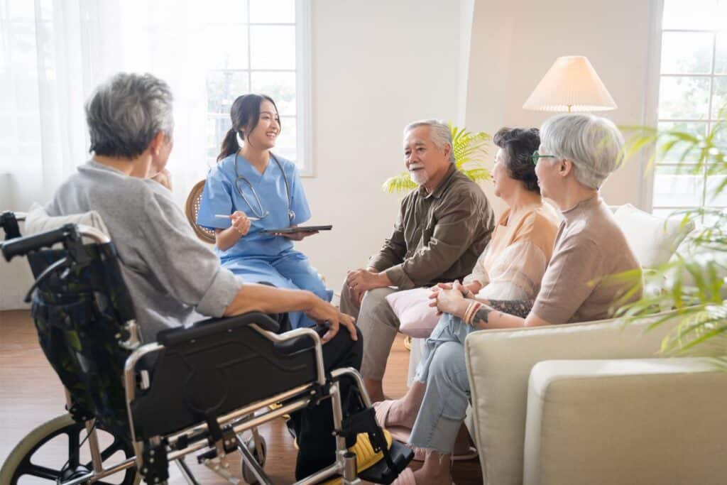 a nurse talking to a group of people